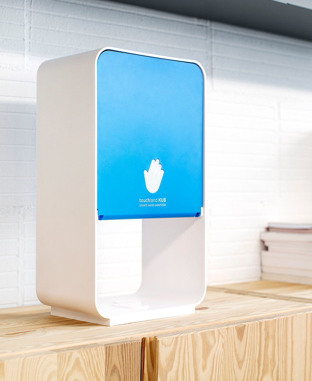 Touchland kub dispenser on wooden table