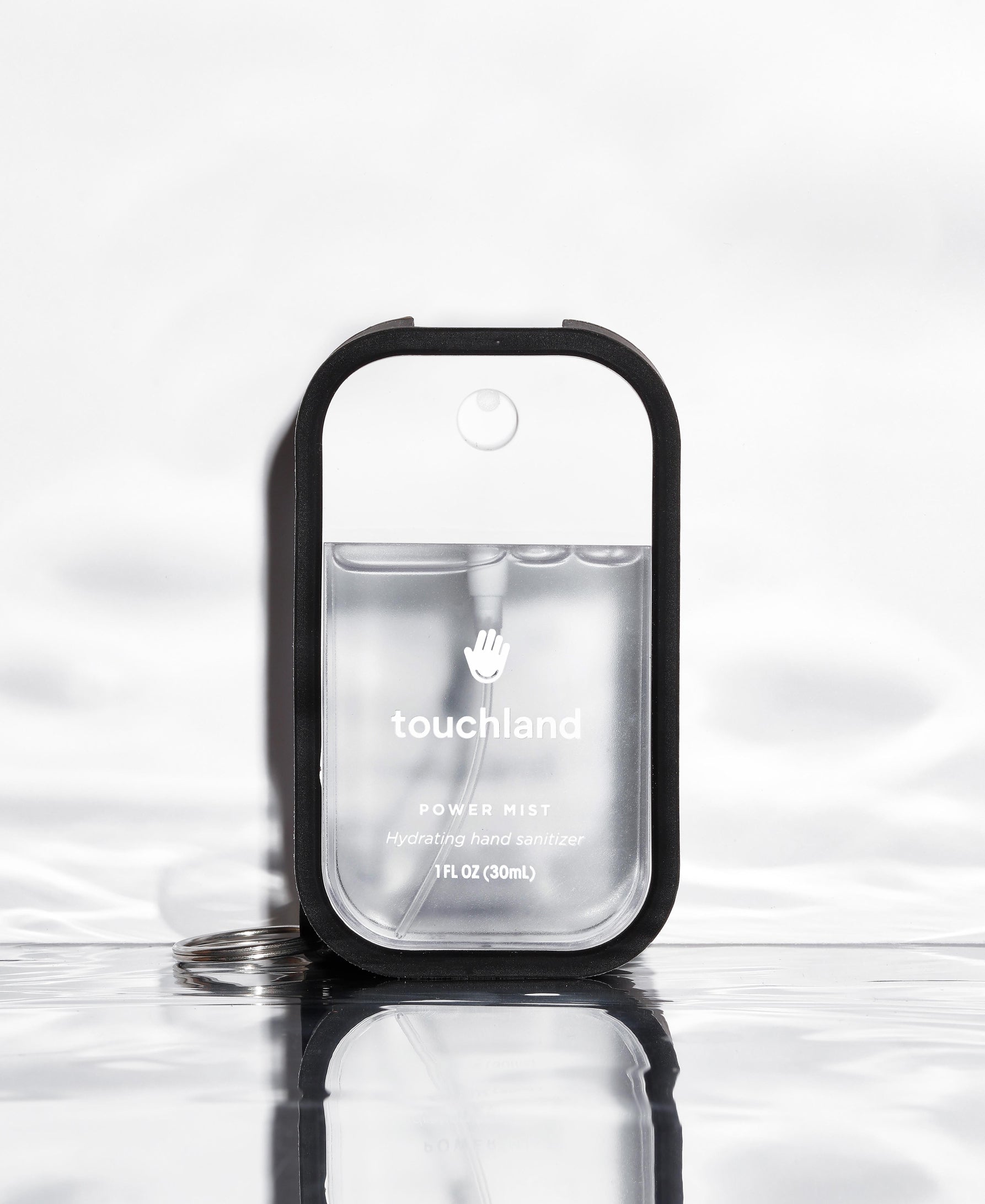 Touchland clear unscented power mist in black mist case on white background