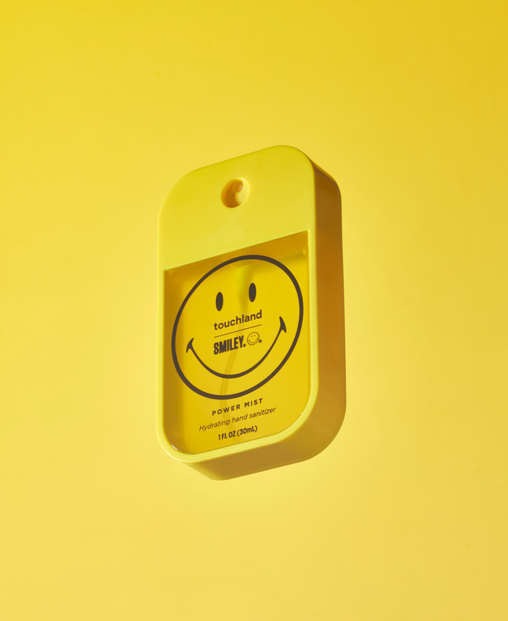 Smiley Power Mist floating on a yellow background#mango-passion