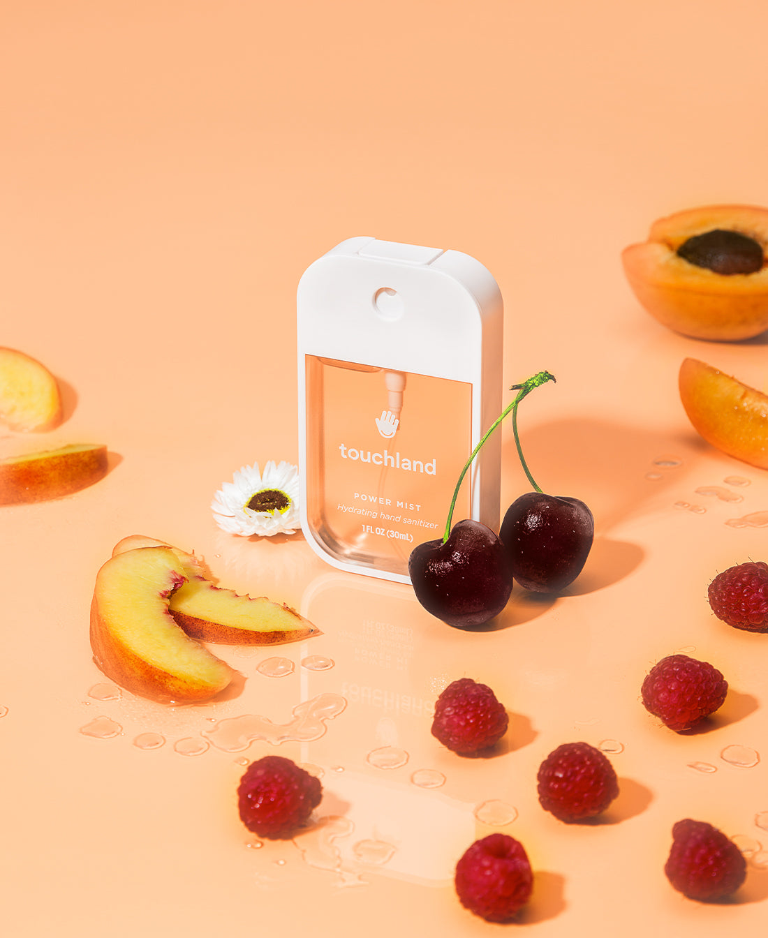 Touchland velvet peach orange power mist with fruits on an orange background