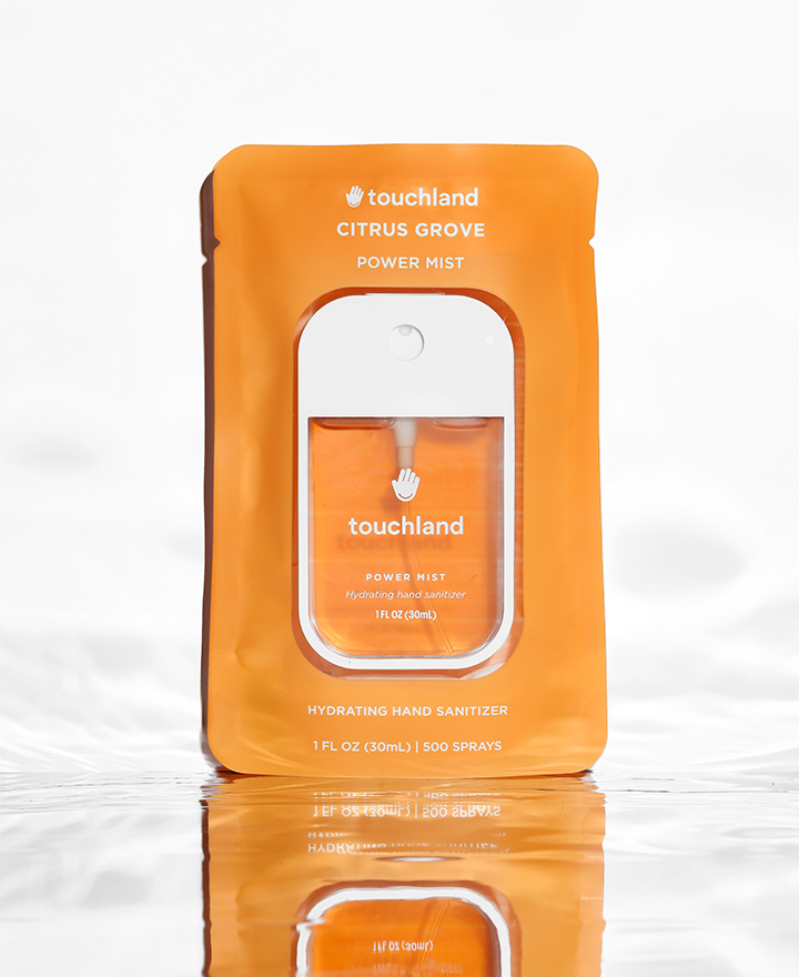 Citrus grove orange power mist in orange packaging on white background