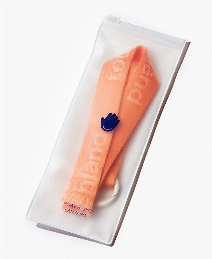 Orange lanyard in clear packaging on white background