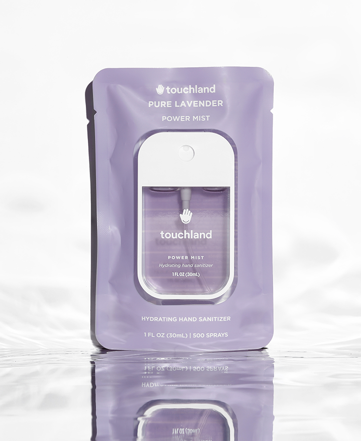 Pure lavender purple power mist in purple packaging on white background