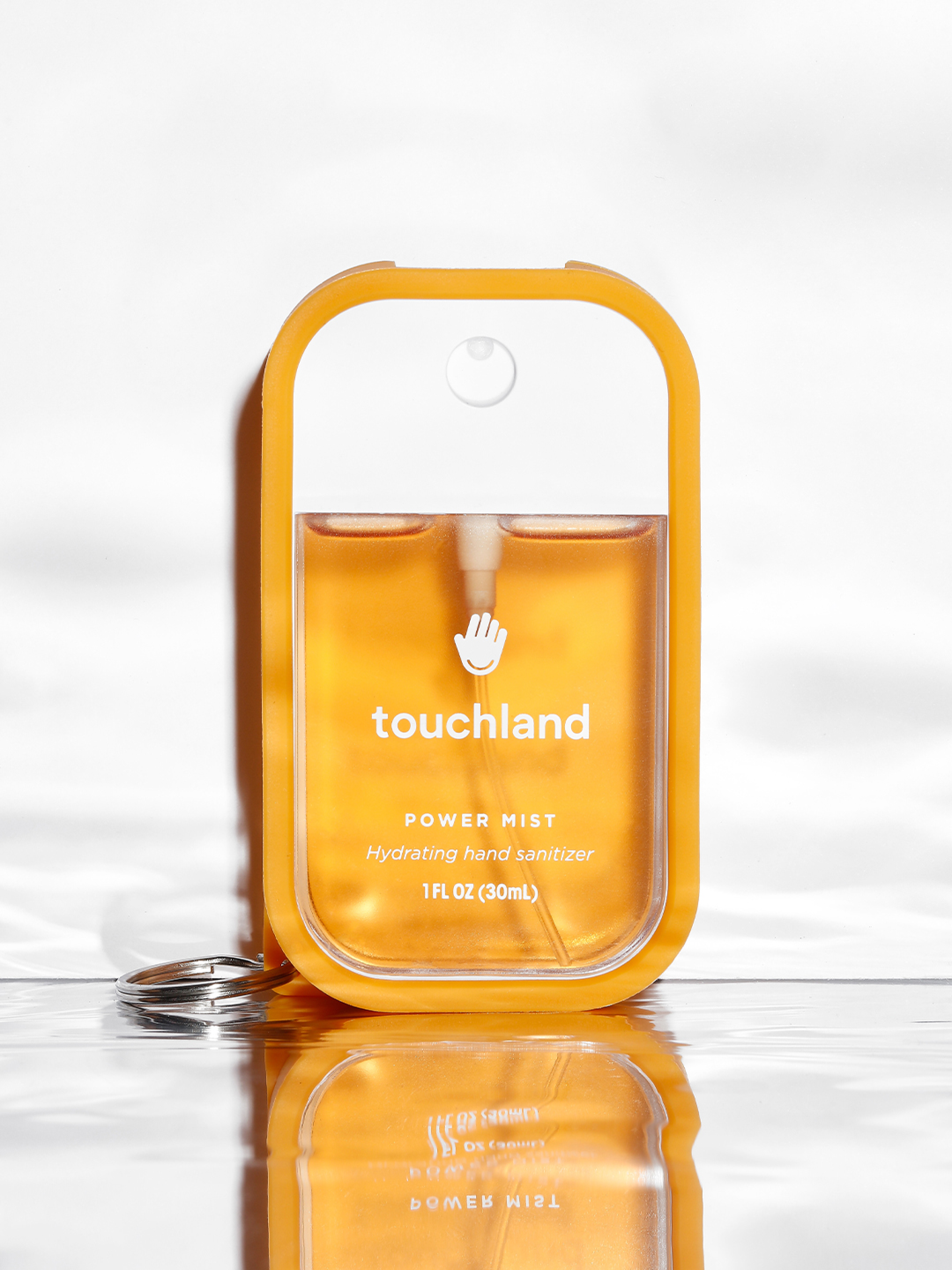 Touchland orange case with orange power mist inside on white background