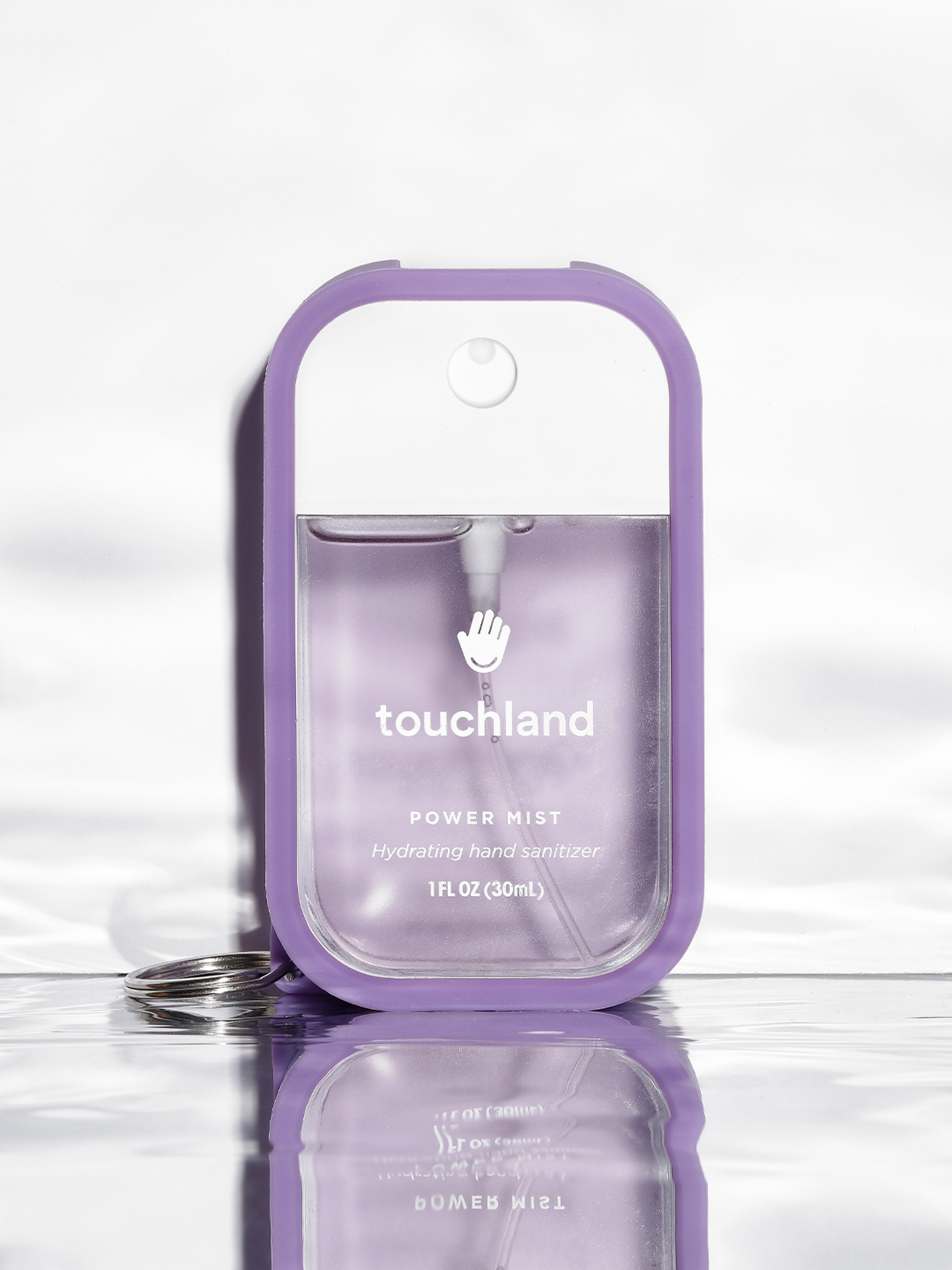 Touchland lavender power mist in purple mist case on white background
